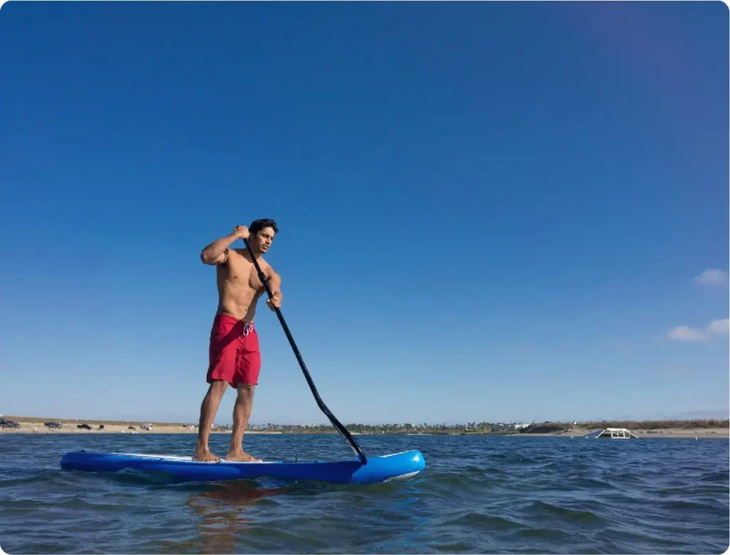 stand up paddling on the sea